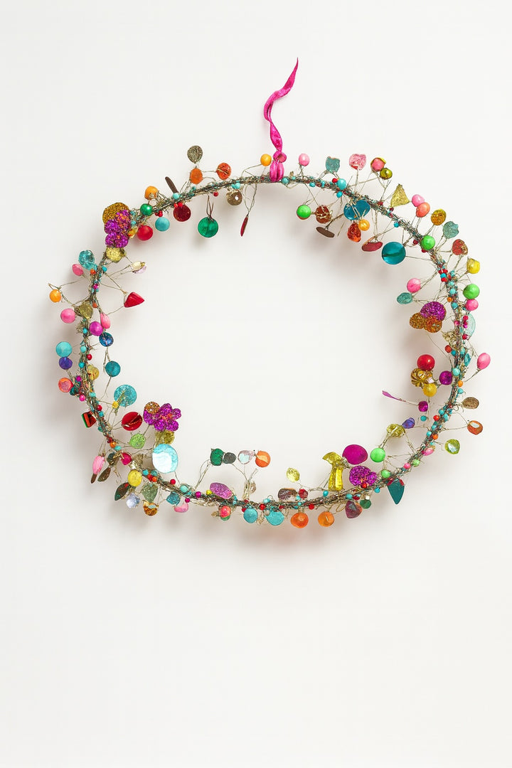 Colorful beaded wreath on a white background