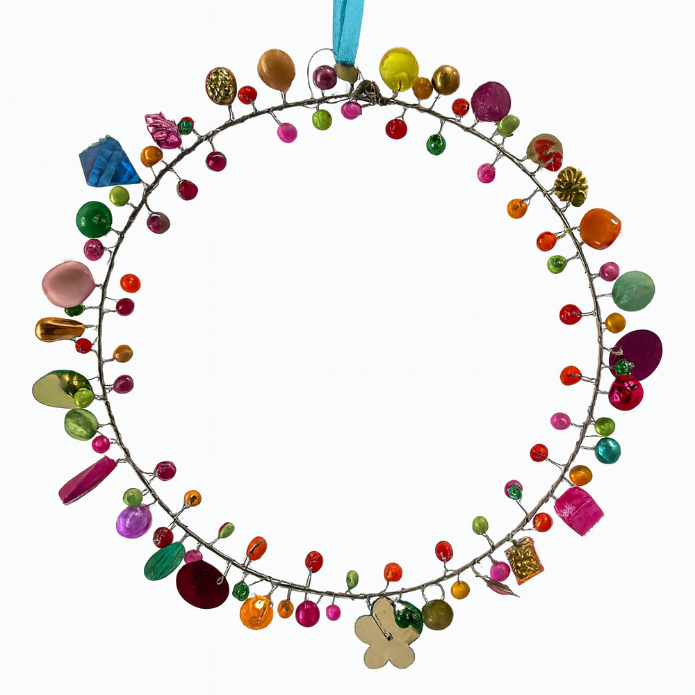 Small Decorative wreath with colourful beads and flowers on a white background