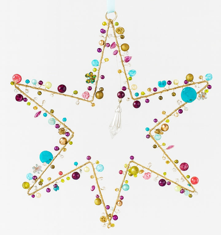 Decorative star with colourful beads on a white background