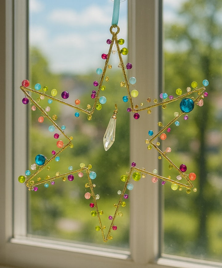 Star Decoration With Beads and Sequins in A window scene