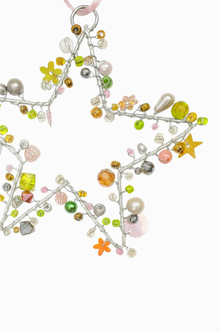 Decorative garland with colourful beads and sequins on a white background