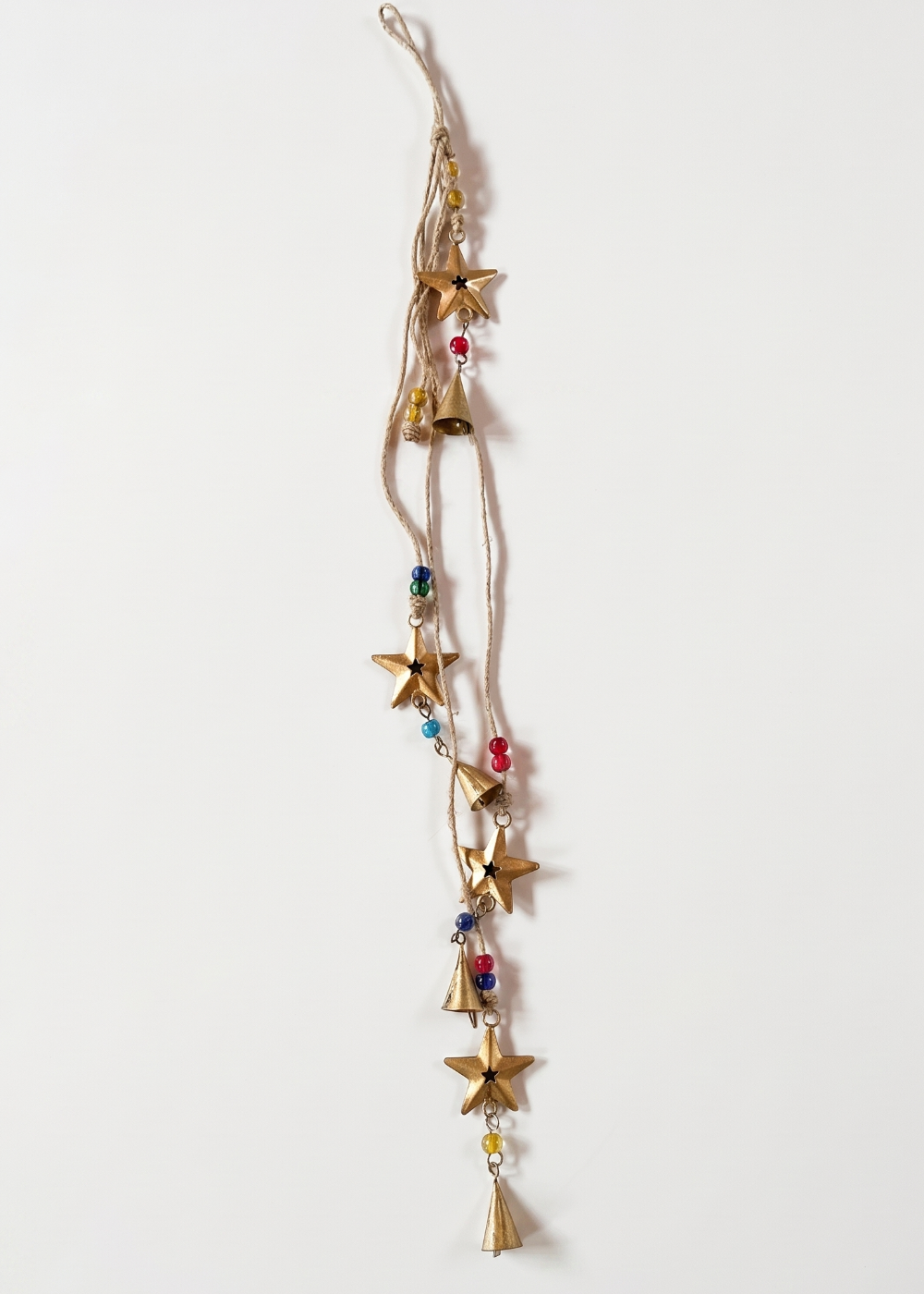 Decorative hanging with stars and beads on a white background