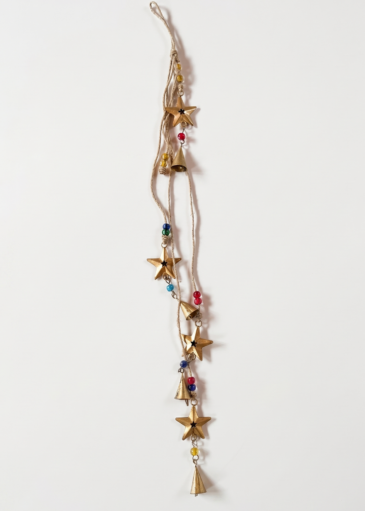 Decorative hanging with stars and beads on a white background