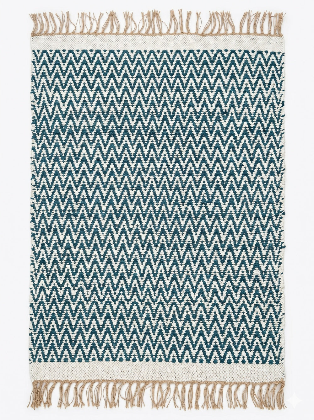 Teal and white chevron patterned rug with beige fringes on a plain background