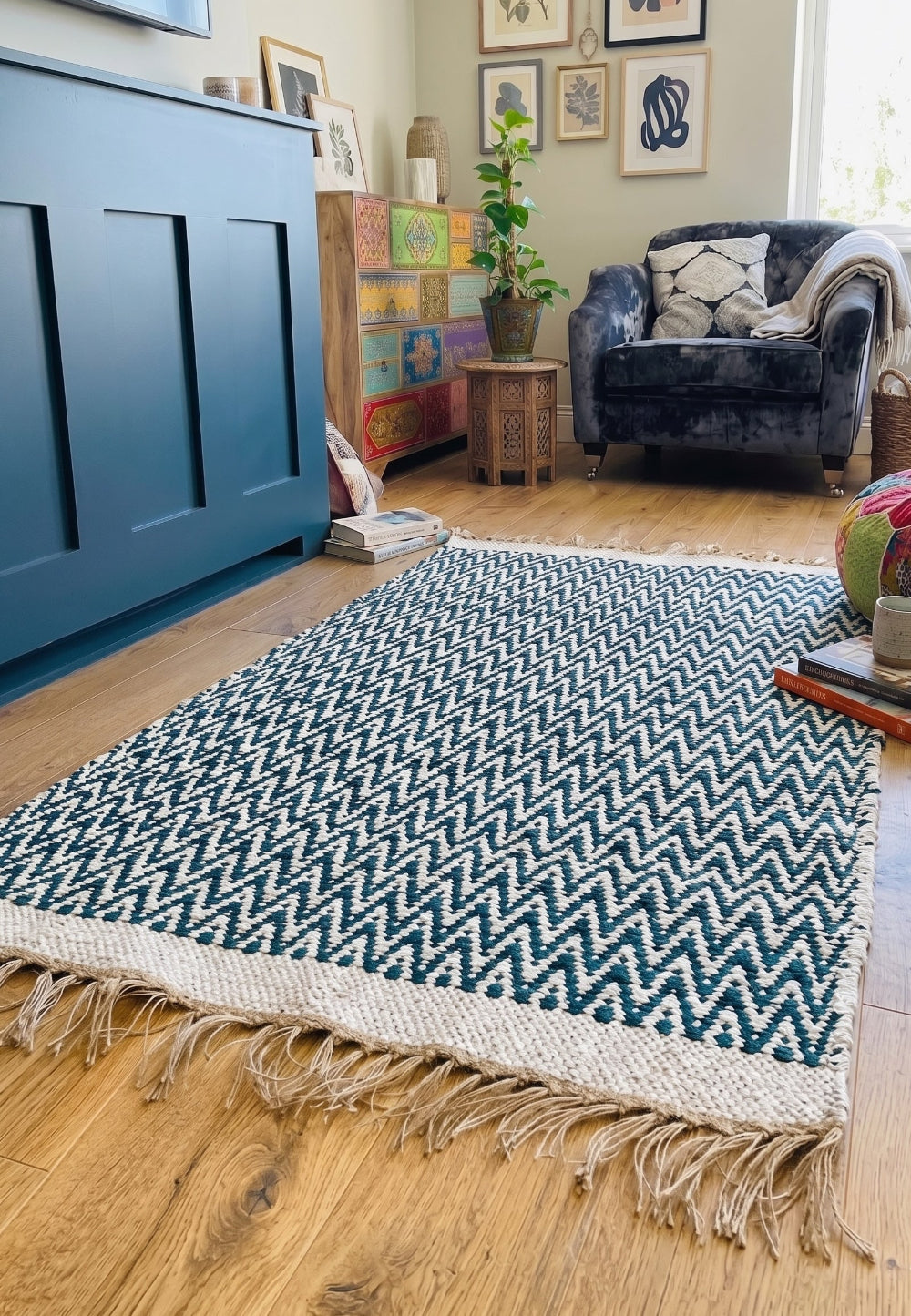 Teal Zig Zag Rug in a living room with chair and fireplace