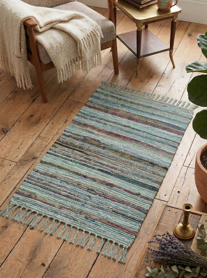 Turquoise Rag Rug With Other Colours on a wooden floor