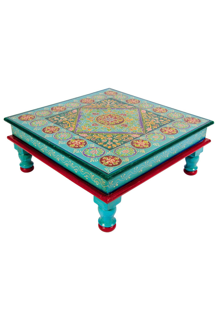 Decorative coffee table with colorful patterns on a white background