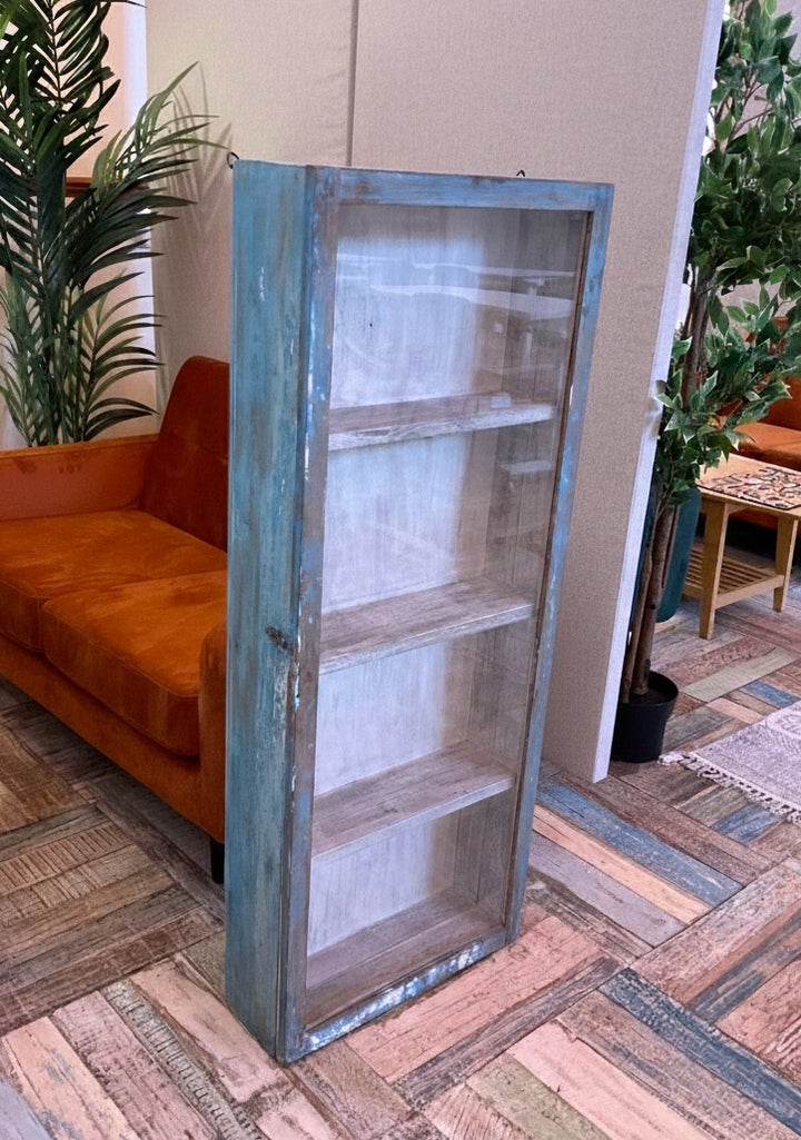 Wooden display cabinet with glass panels on a patterned floor.