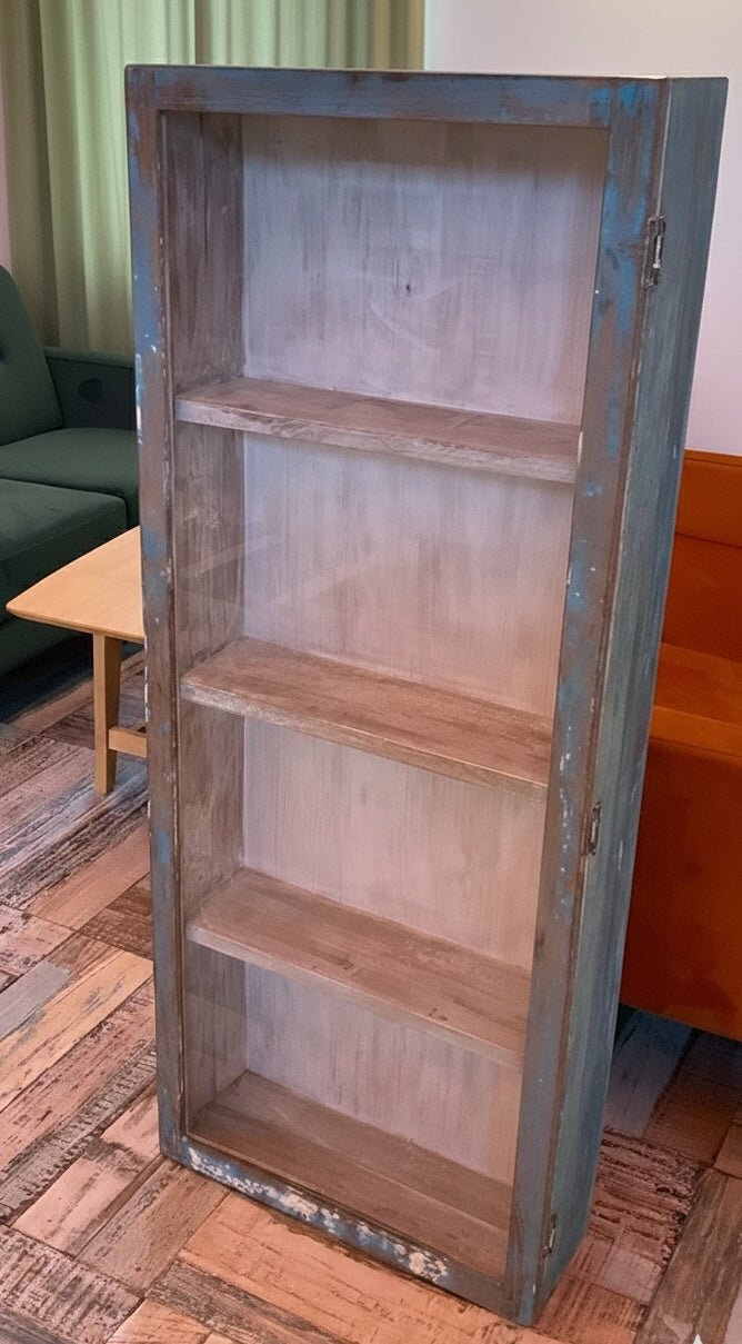 Wooden bookshelf with metal frame in a room setting