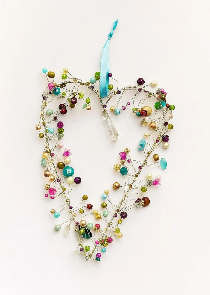 Love Heart Beaded Decoration With Light Blue Ribbon In a White Background