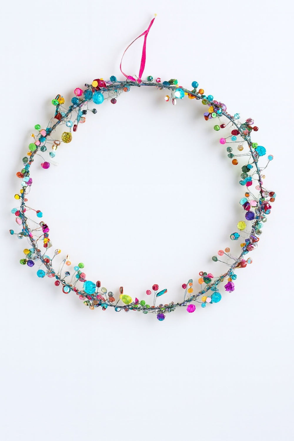 Colourful beaded decoration on a white background