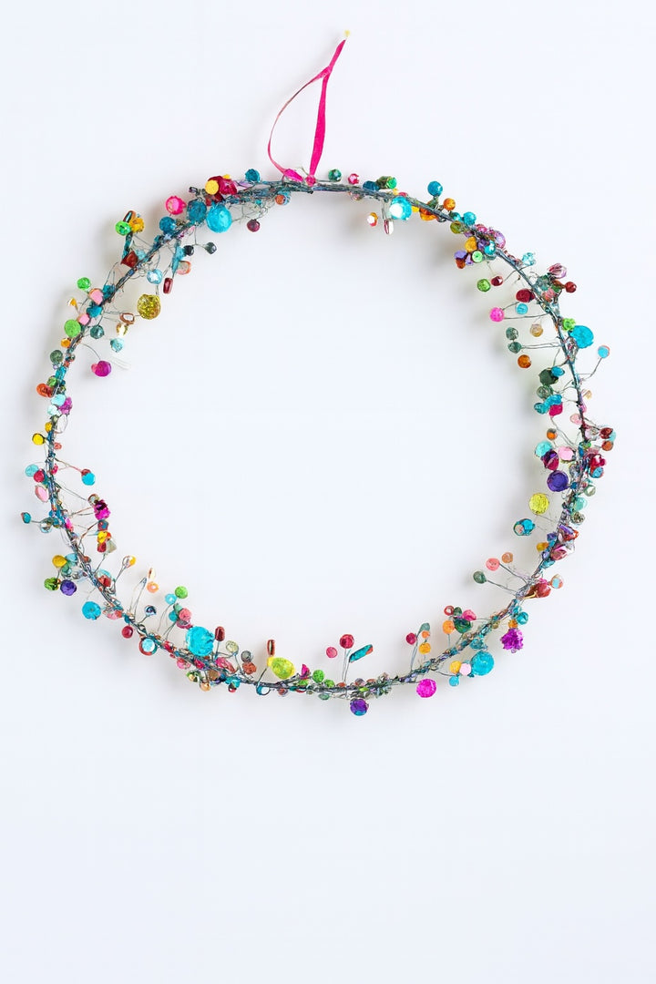 Colourful beaded decoration on a white background