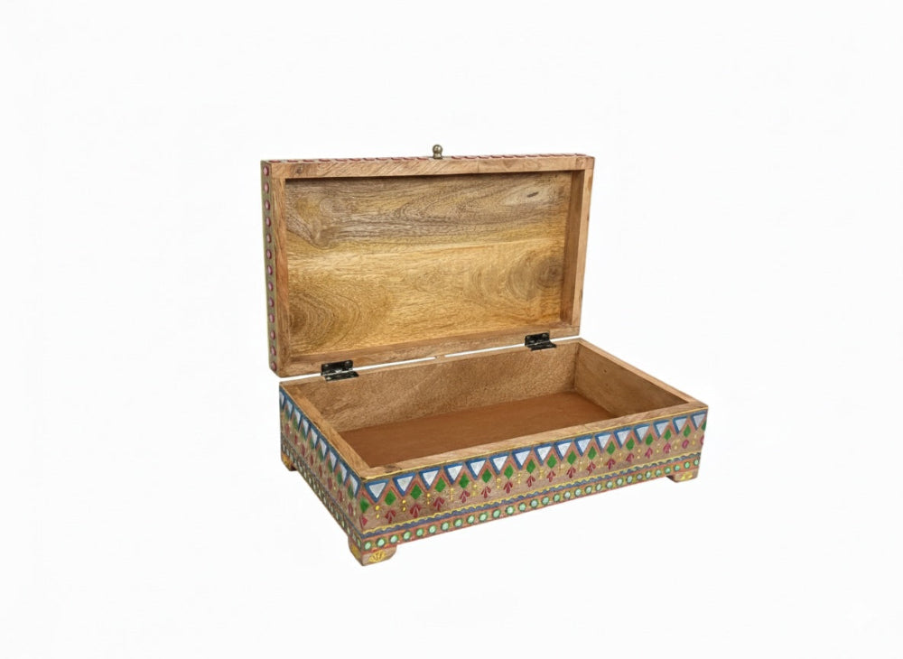Wooden storage chest with decorative patterns on a white background