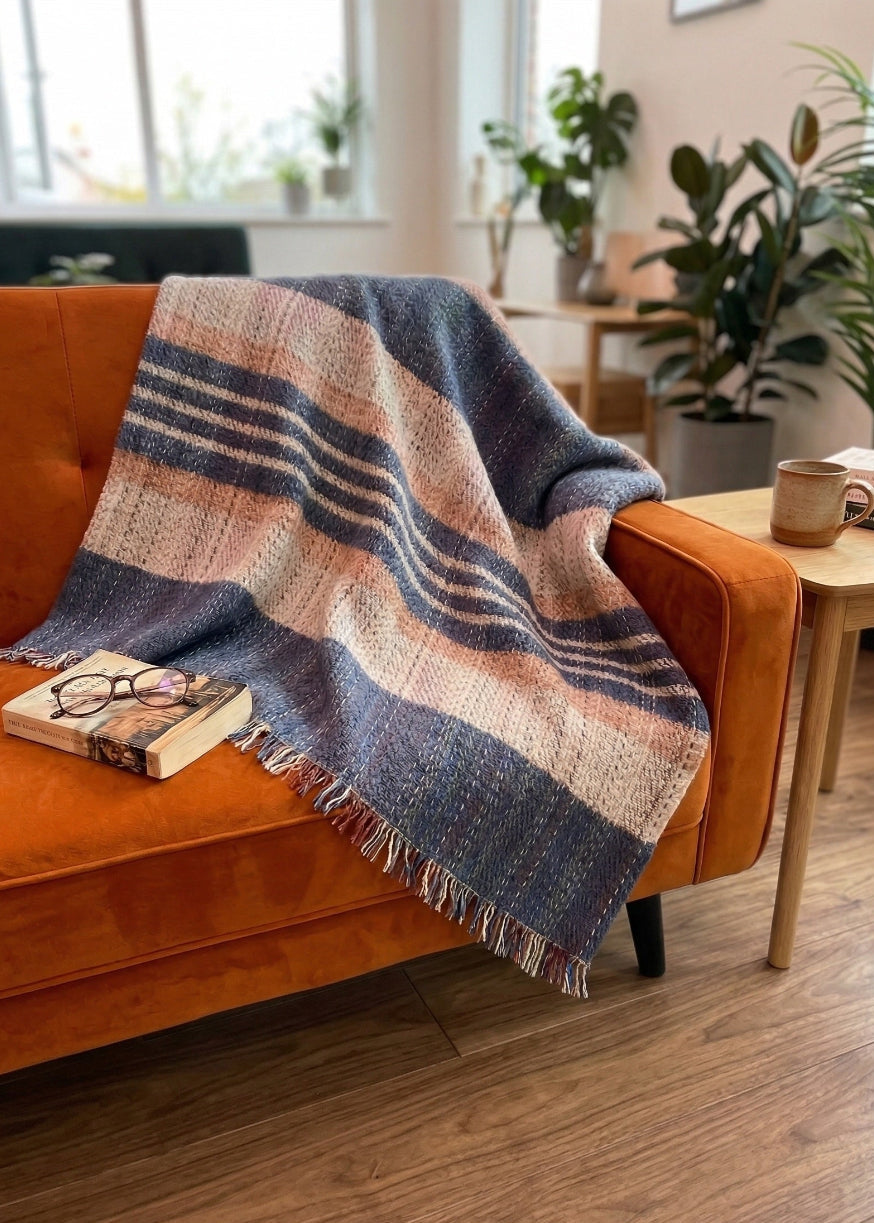 Wool Throw over the back of a orange sofa in a living room