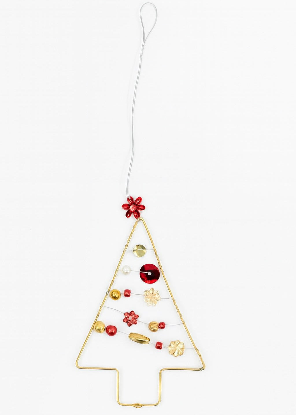 Decorative Christmas tree ornament with red and gold elements on a white background