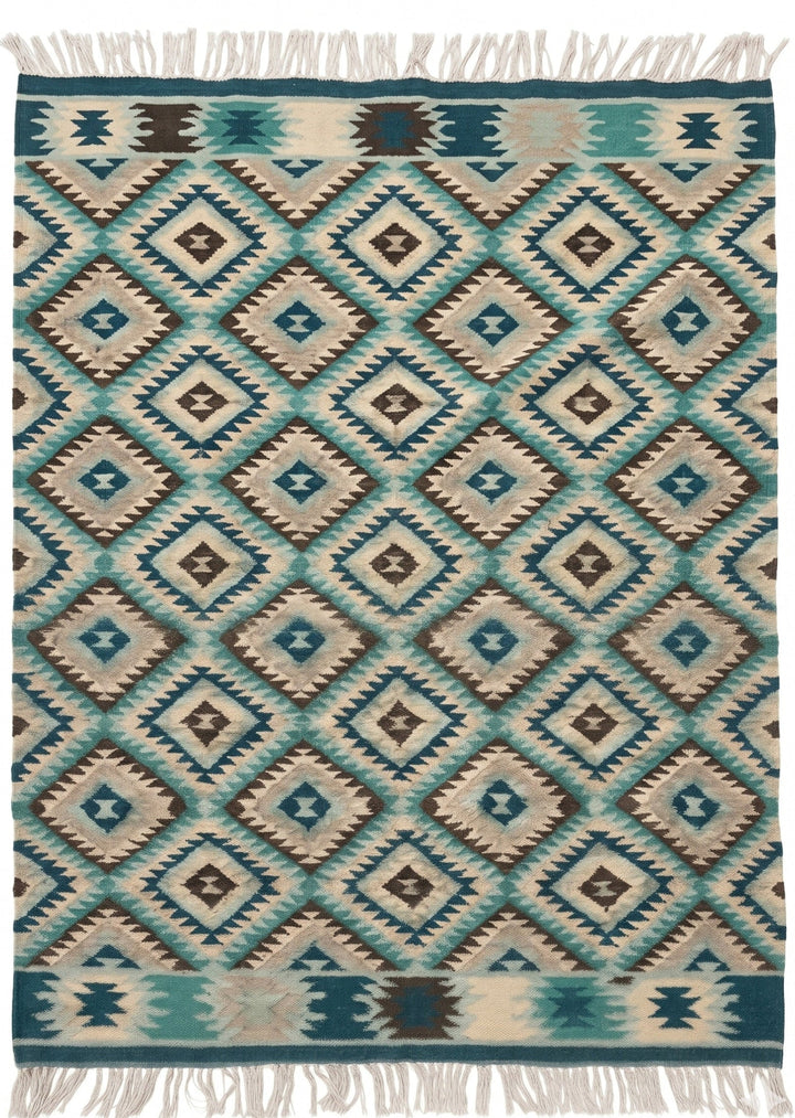 Woven rug with geometric pattern in teal, brown, and beige on a white background