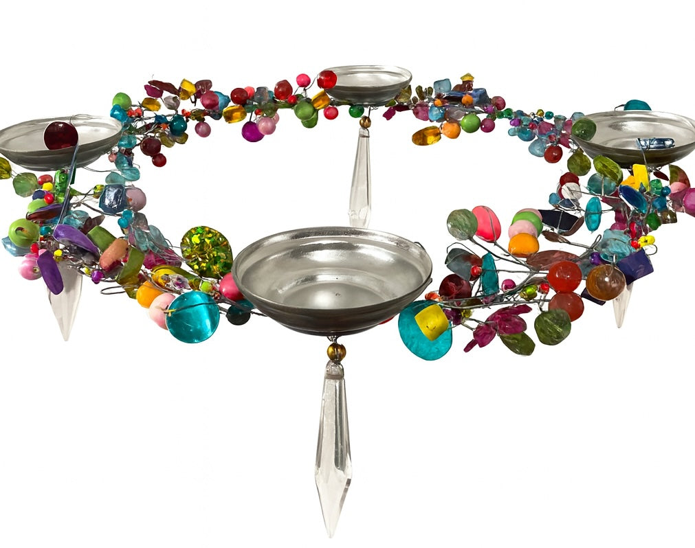 Decorative hanging with colourful beads and metal t light bowls on a white background