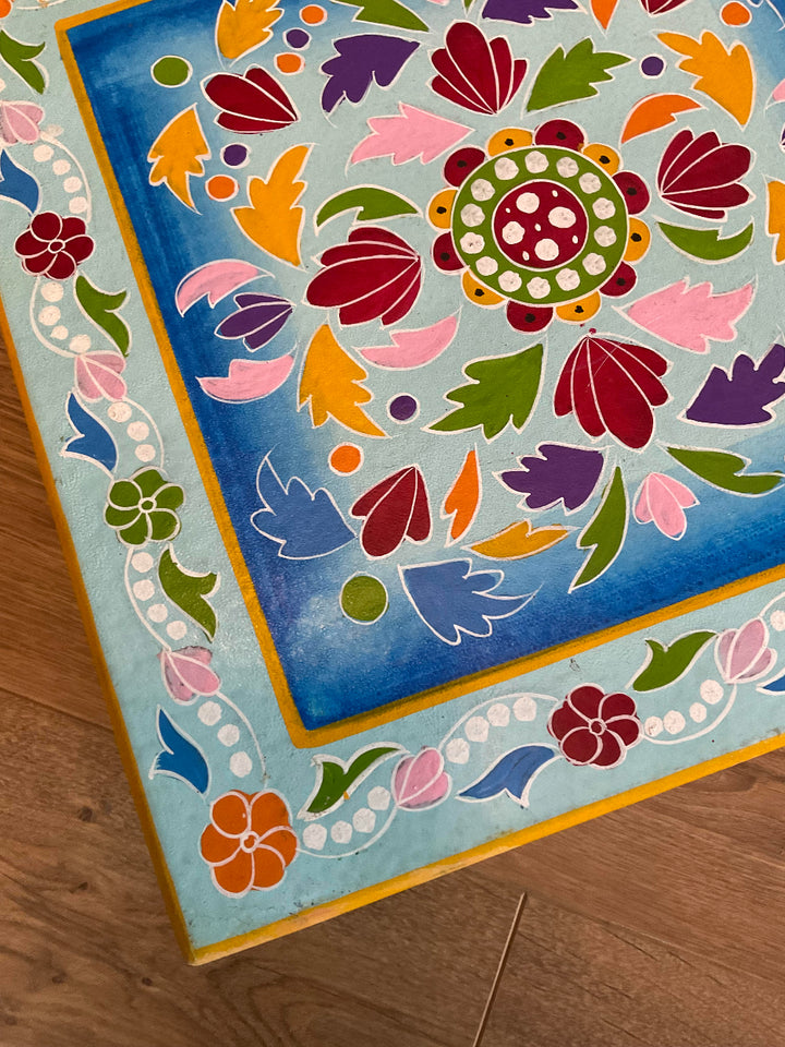 Close Up Colourful floral design on a wooden table