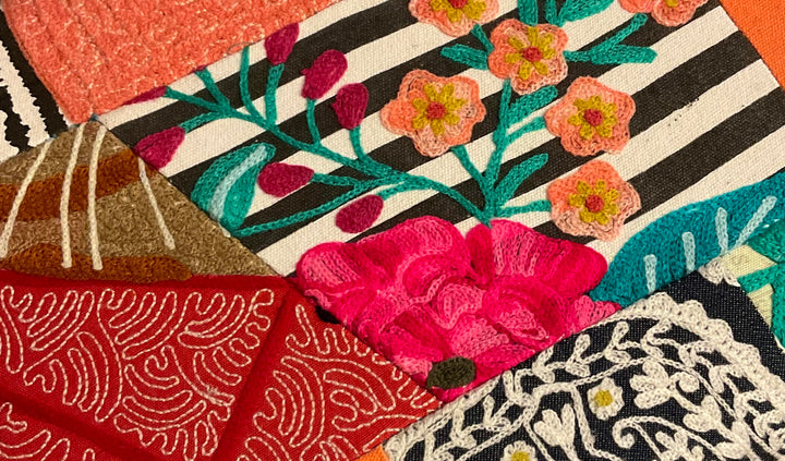 Colourful textured fabric with floral patterns and stripes