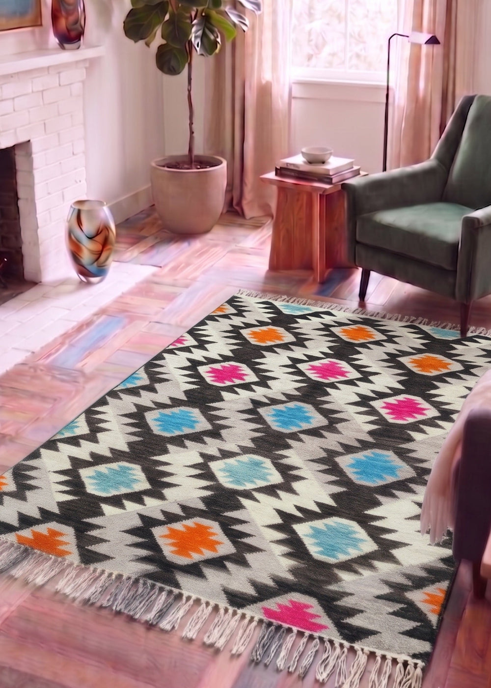 A rectangular area rug with a Southwestern geometric pattern in black, cream, light blue, orange, and pink, styled on a rustic wooden floor in a cosy living room setting.