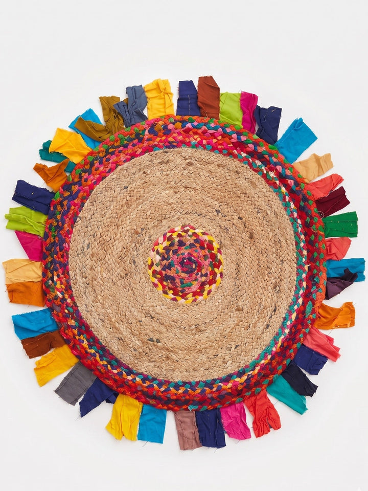 Round jute rug with colourful tassels on a white background