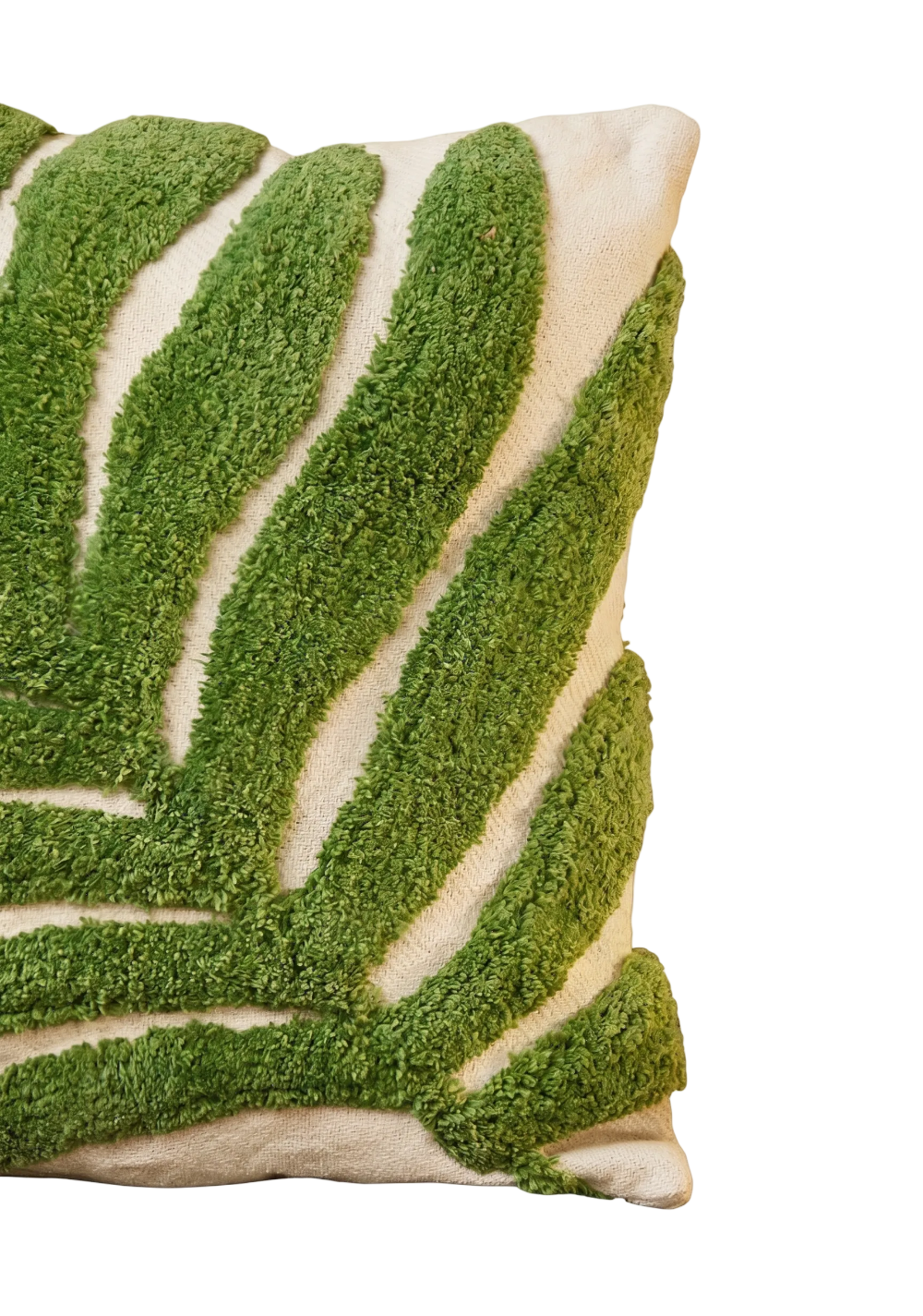 A close-up of a textured throw pillow featuring a green and cream leaf pattern, shown against a plain white background.
