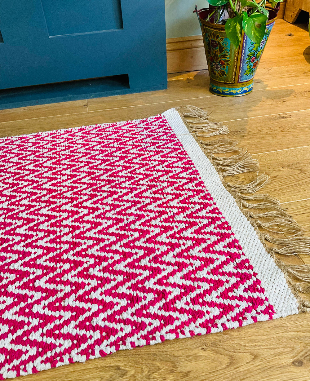 Close Up of Pink Rug on a Laminate Floor