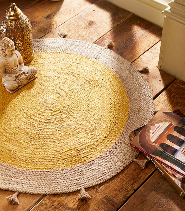 Jute Round Rug With a Buddha Sitting in the rug